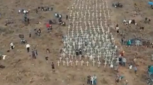 Thumbnail for White South African farmers plant crosses for every White farmer murdered, creating a one huge cross.